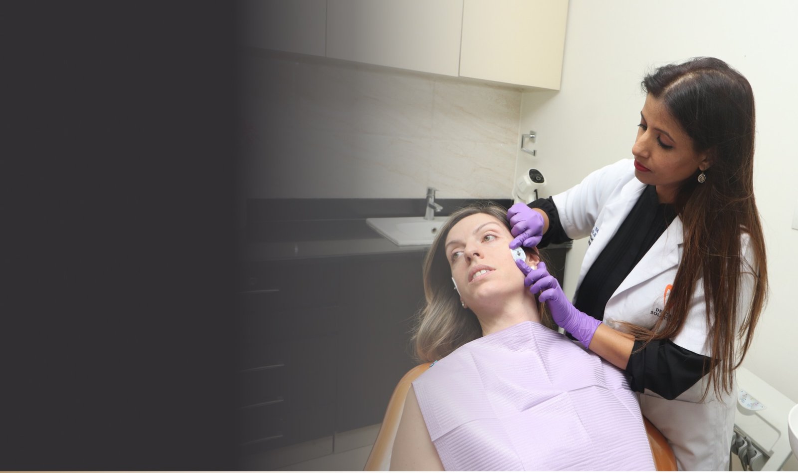 Dr. Manisha Yadav examining a patient in a premium clinical setting
